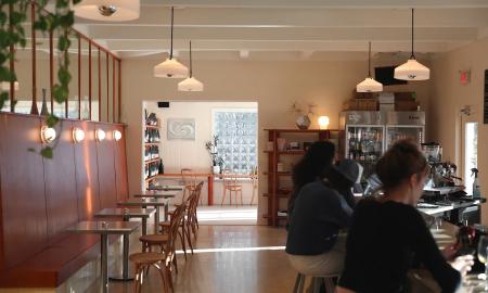 The inside of the cafe with seating along the walls