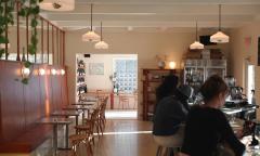 The inside of the cafe with seating along the walls