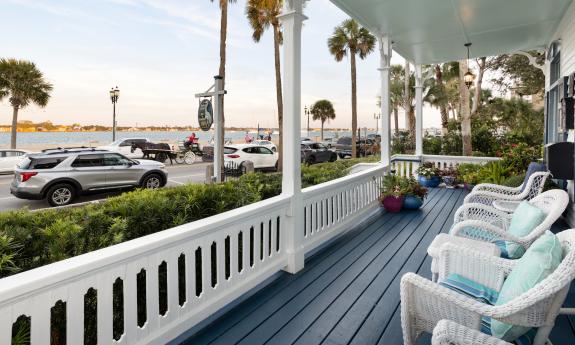 All guests have access to this streetfront porch at this bed and breakfast property in St. Augustinee
