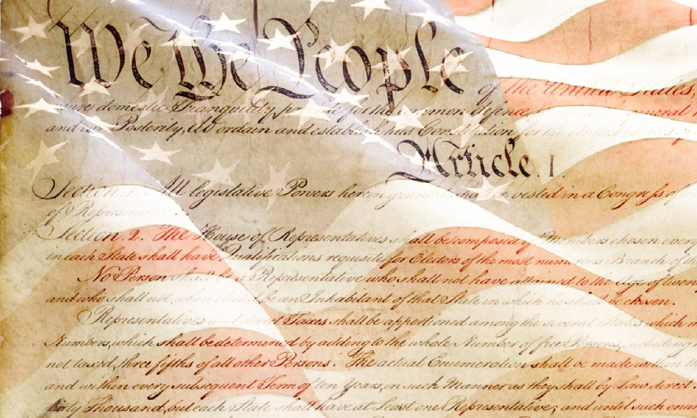 The constitution superimposed over the American flag