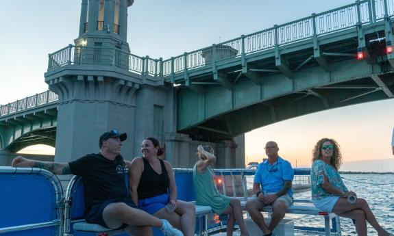 A Florida Water Tours boat passes under the Bridge of Lions