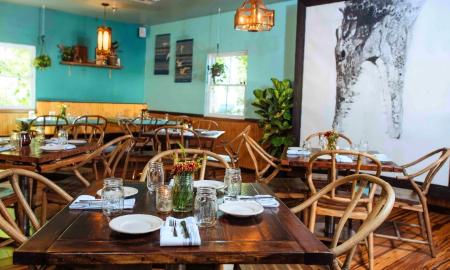 The dining room at the Floridian has a large print of an alligator in black and white