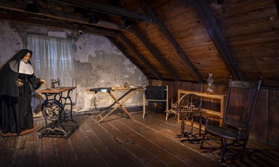 A room setup with one of the Sisters of St. Joseph figures upstairs