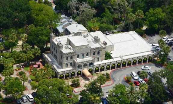 An aerial view of Ripley's Odditorium in St. Augustine, showing the many leafy trees surrounding the building and parking lot