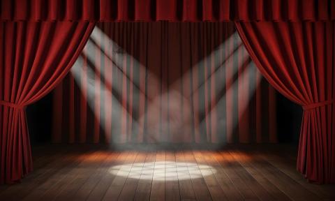 Spotlights centered on a stage