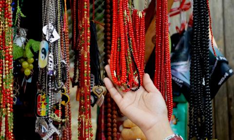 Assorted jewelry pieces displayed at a market