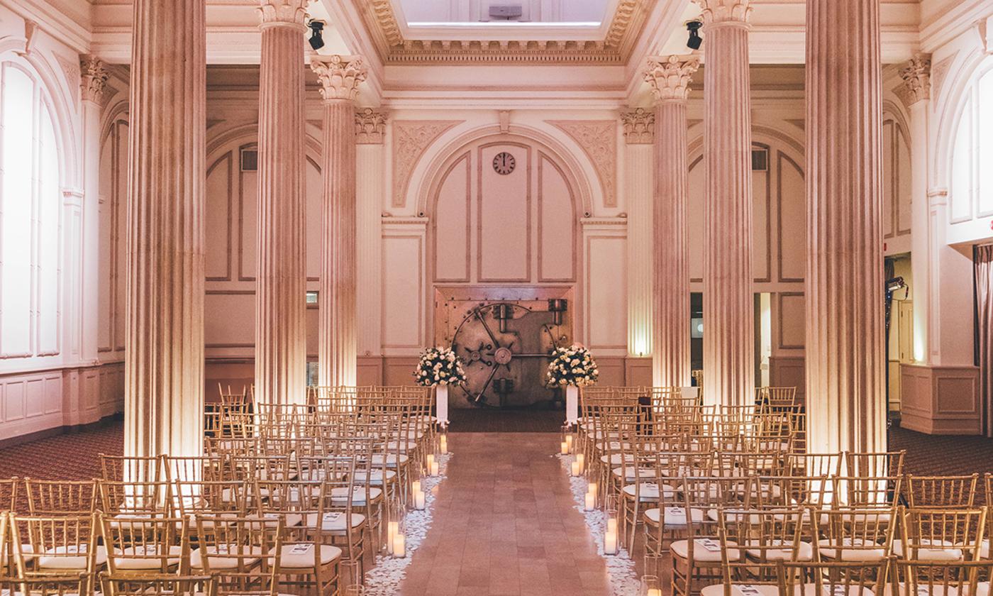 The Treasury on the Plaza arranged for a wedding ceremony, with flowers at the front
